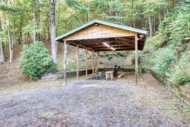 a view of a house with a yard and roof