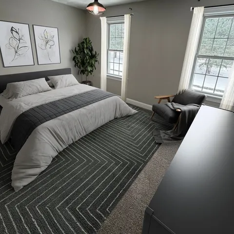 a bedroom with double bed and a window