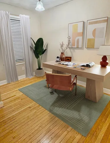 a living room with stainless steel appliances kitchen island granite countertop furniture and a rug