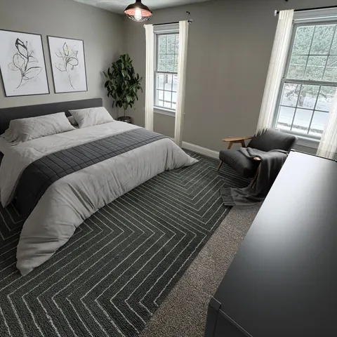 a bedroom with double bed and a window