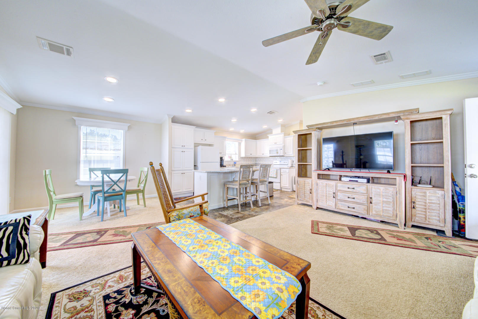 1256 Shell Court Northeast Palm Bay, FL 32907 - Photo 14 of 40 living room open to kitchen & dining