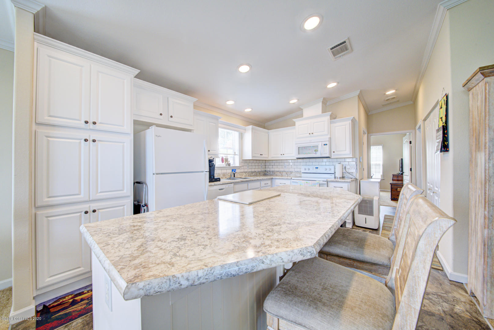 1256 Shell Court Northeast Palm Bay, FL 32907 - Photo 17 of 40 kitchen island with bar seating