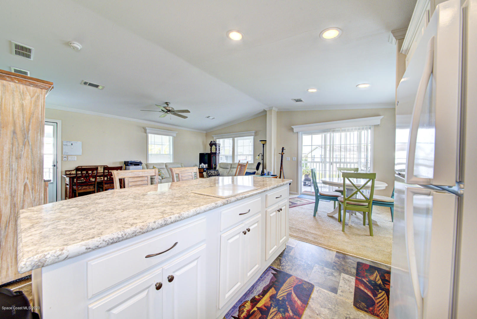 1256 Shell Court Northeast Palm Bay, FL 32907 - Photo 18 of 40 kitchen open to dining room