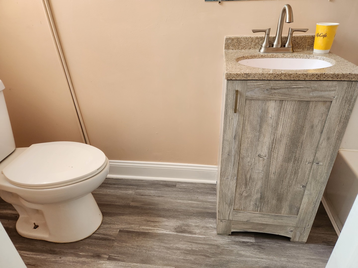 7 National Street, Unit 7 Elgin, IL 60123 - Photo 7 of 10 a bathroom with a sink and a toilet