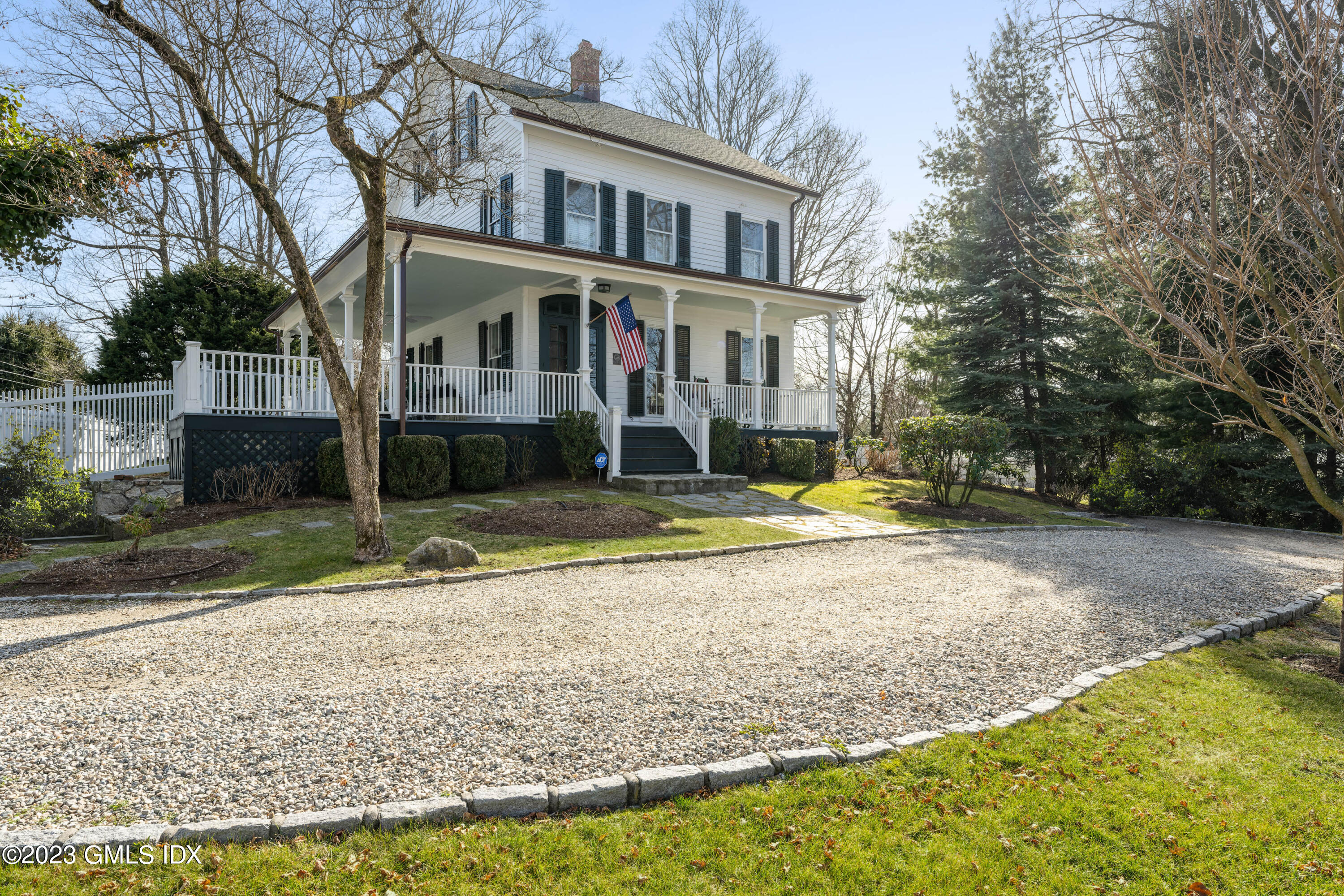93 Riverside Avenue Riverside, CT 06878 - Photo 1 of 19 a view of a house with a yard and sitting area