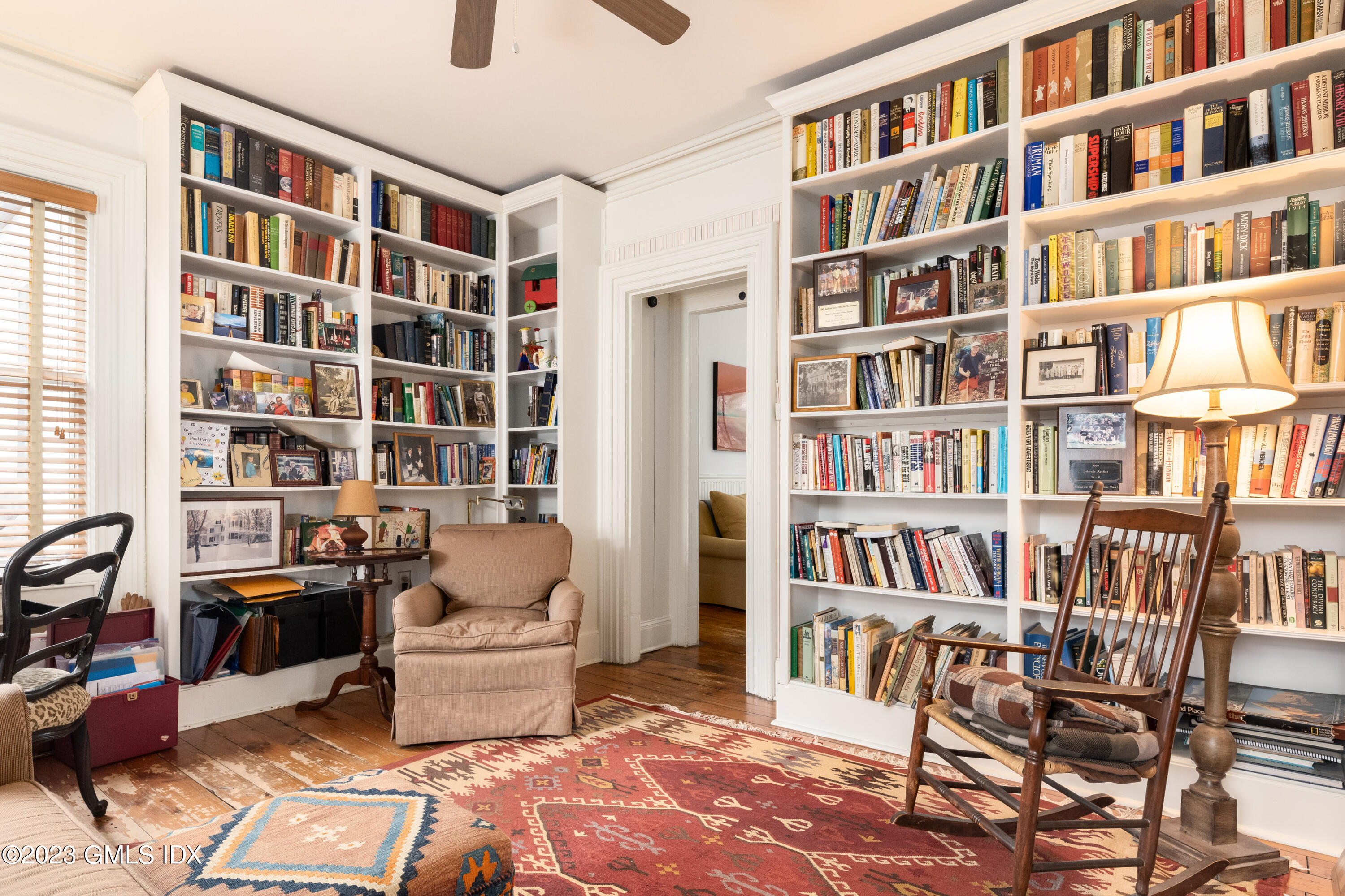 93 Riverside Avenue Riverside, CT 06878 - Photo 13 of 19 a living room with a book shelf and a book shelf