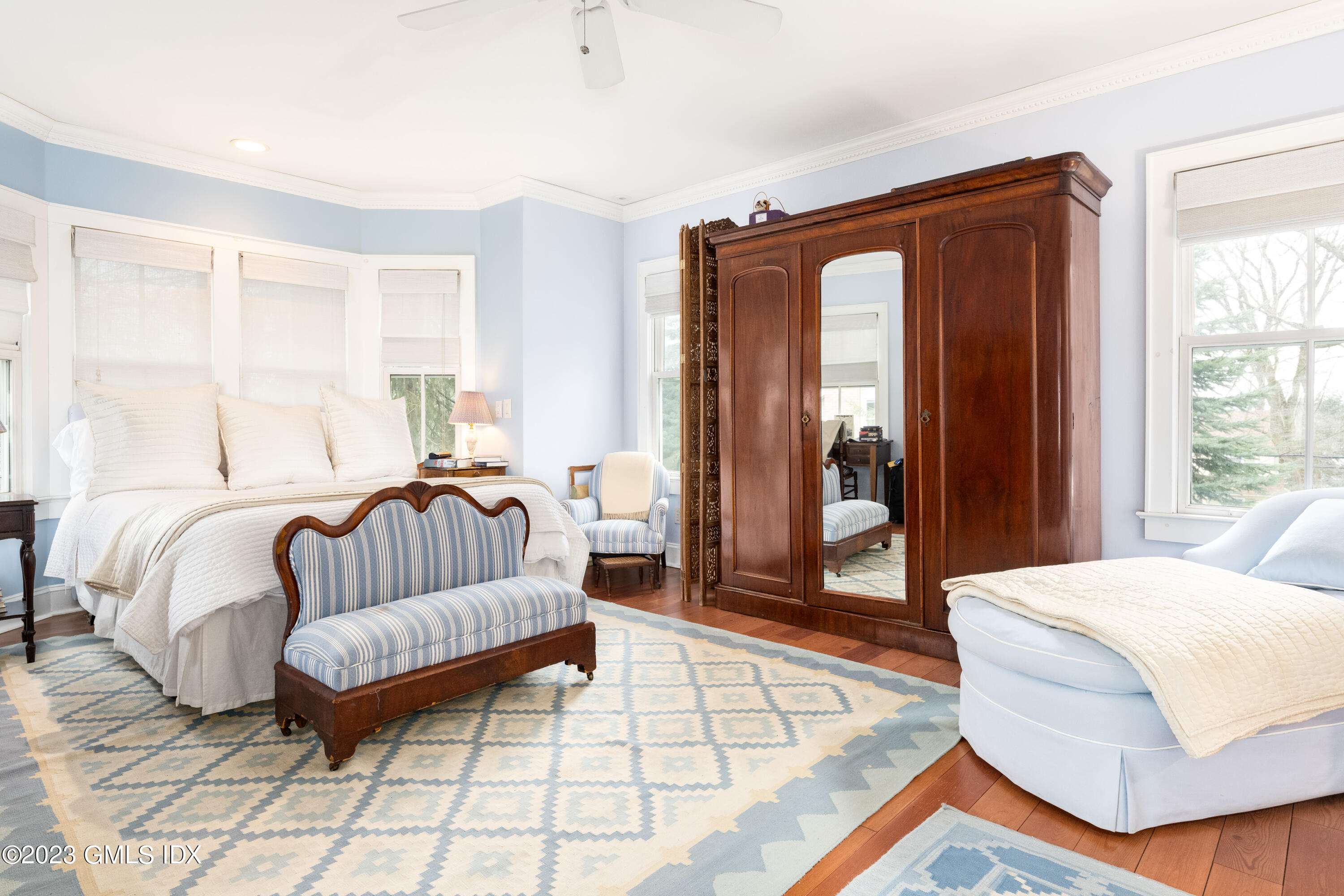93 Riverside Avenue Riverside, CT 06878 - Photo 14 of 19 a spacious bedroom with a bed and walk in closet