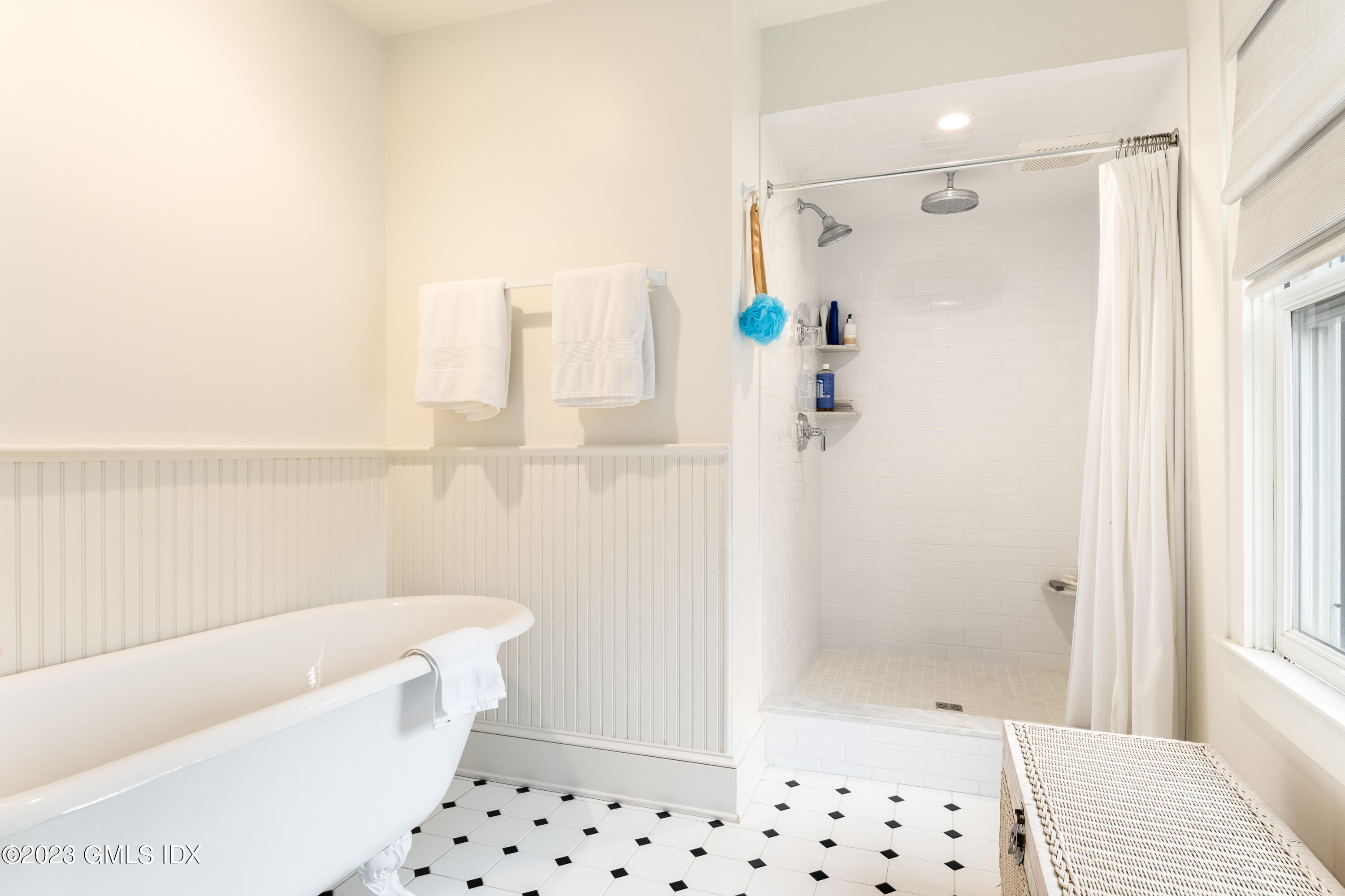 93 Riverside Avenue Riverside, CT 06878 - Photo 15 of 19 a bathroom with a shower a bathtub and a shower