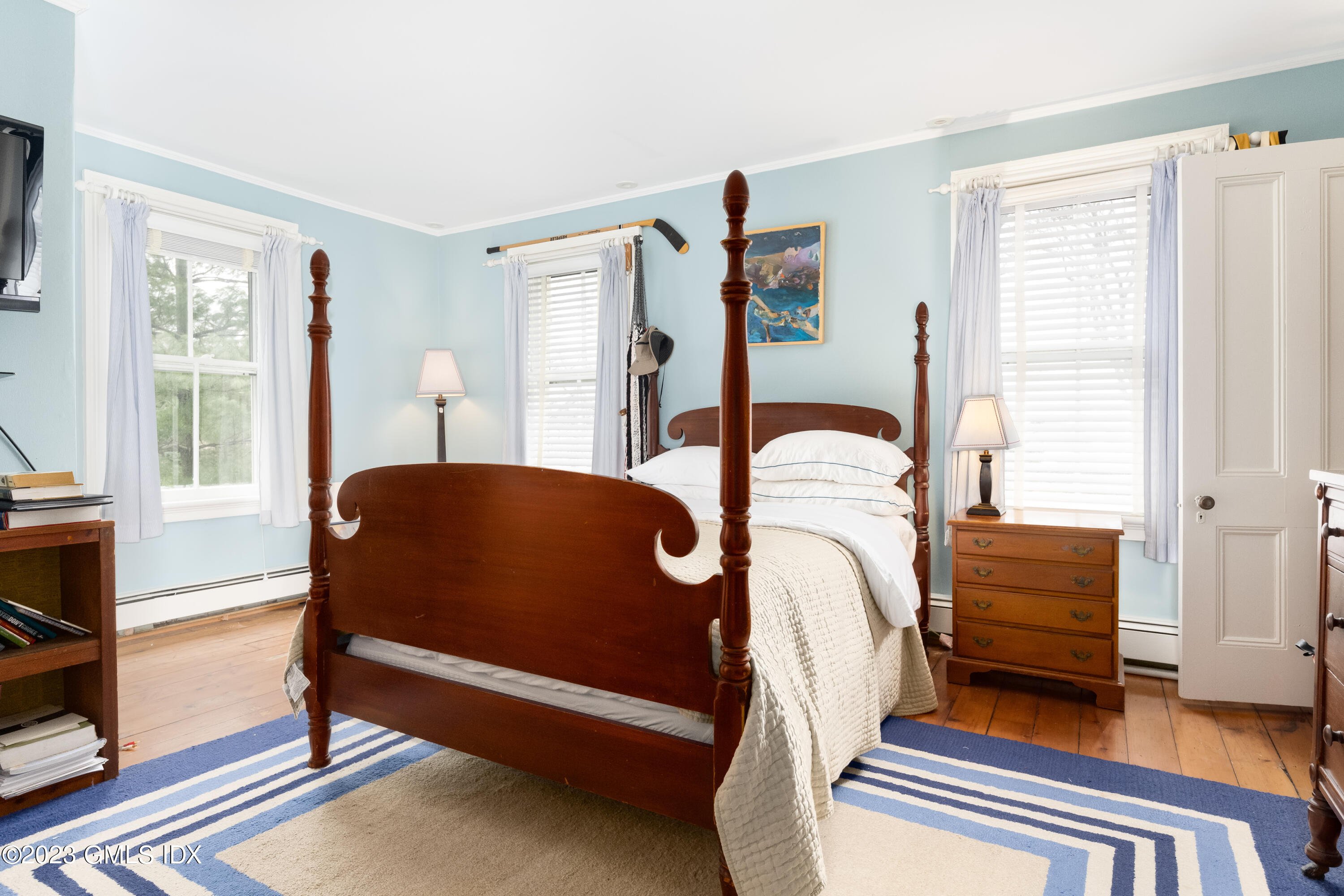 93 Riverside Avenue Riverside, CT 06878 - Photo 16 of 19 a bedroom with furniture and wooden floor