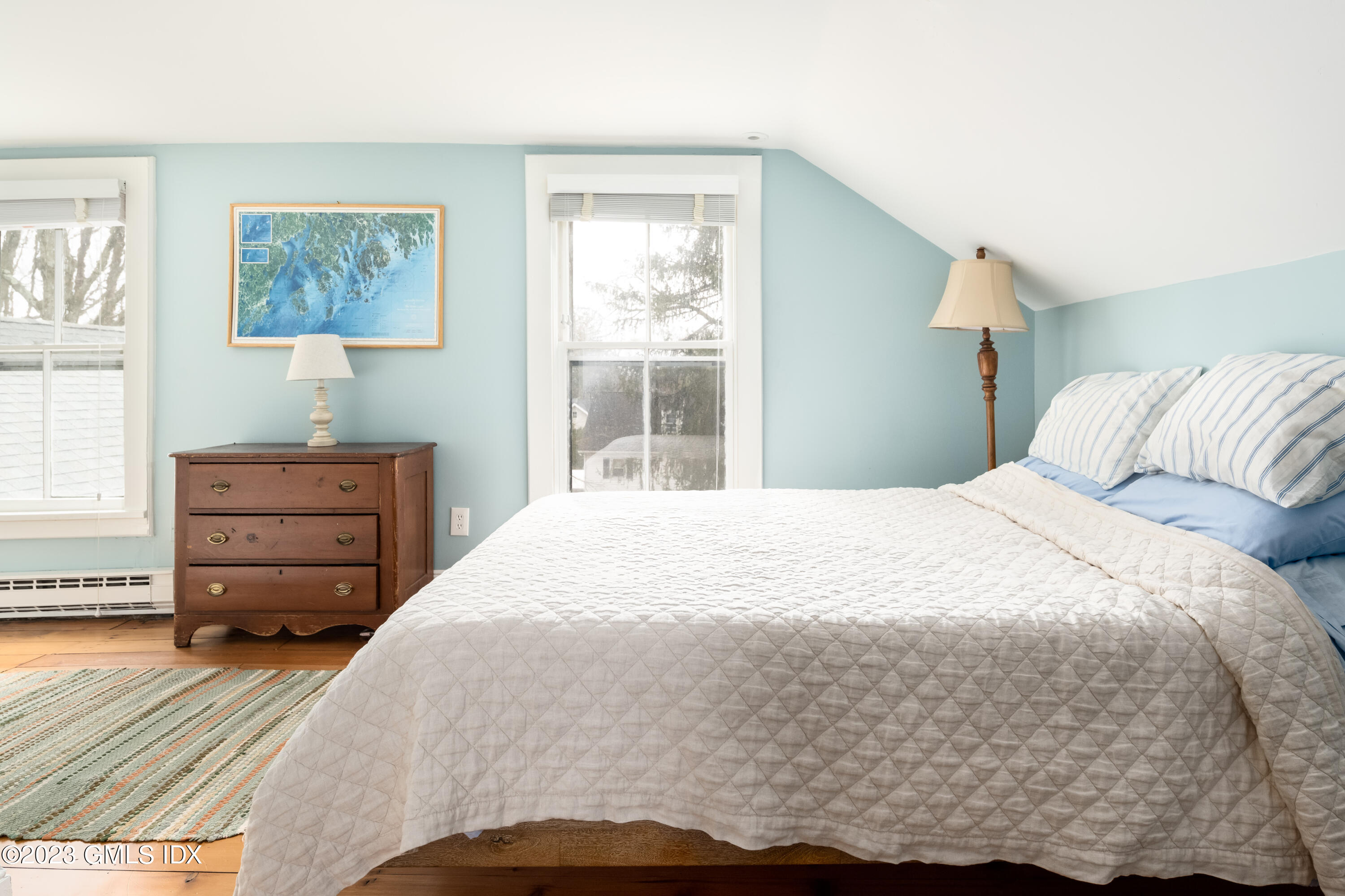 93 Riverside Avenue Riverside, CT 06878 - Photo 19 of 19 a bedroom with a bed and a dresser