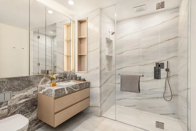 a bathroom with a double vanity sink mirror and double