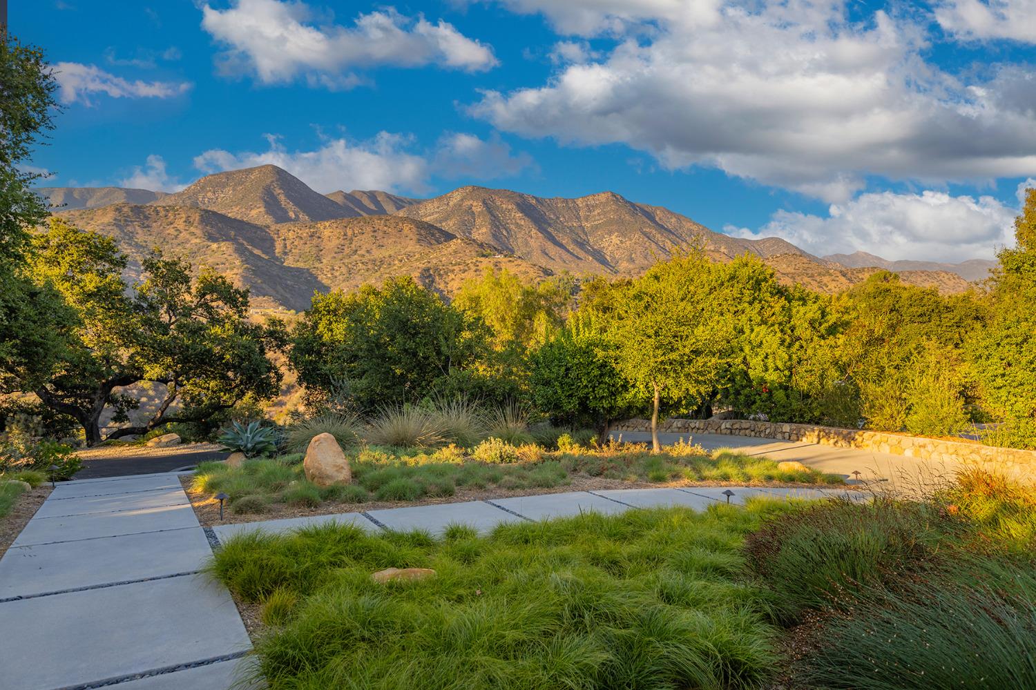 276 Running Ridge Trail Ojai, CA 93023 - Photo 24 of 31 a view of a yard with mountains in the background