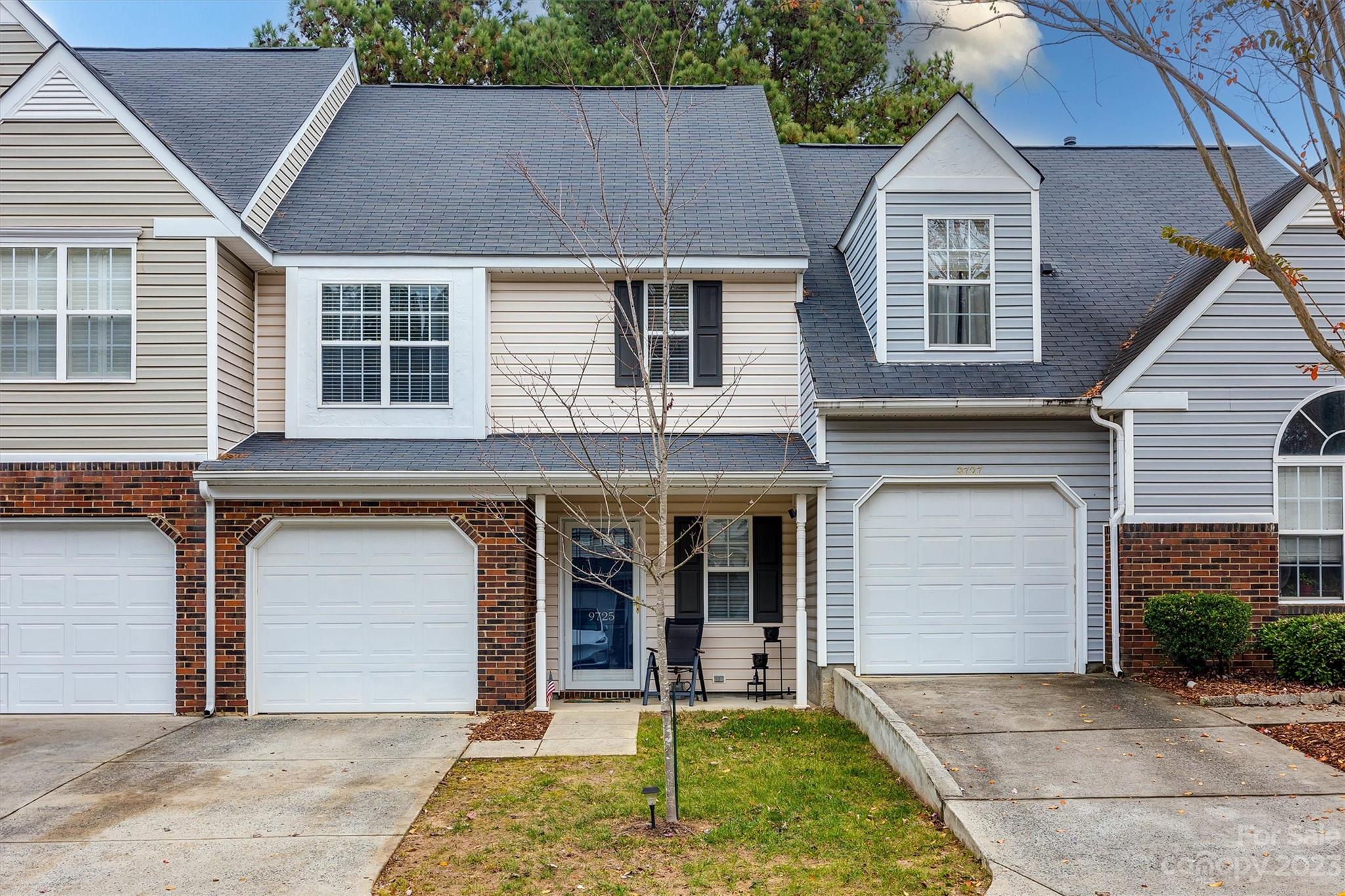 9725 Mattforest Circle Charlotte, NC 28277 - Photo 1 of 29 a front view of a house with a yard and garage