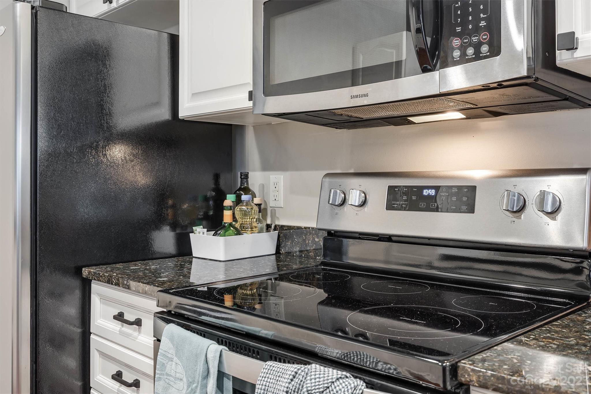 9725 Mattforest Circle Charlotte, NC 28277 - Photo 14 of 29 a stove top oven sitting inside of a kitchen