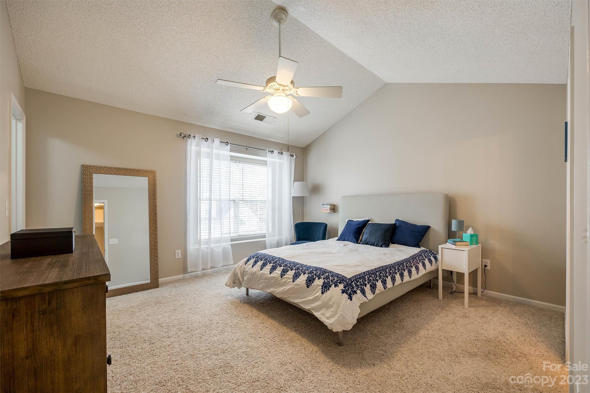 9725 Mattforest Circle Charlotte, NC 28277 - Photo 18 of 29 a bedroom with a bed and a tv