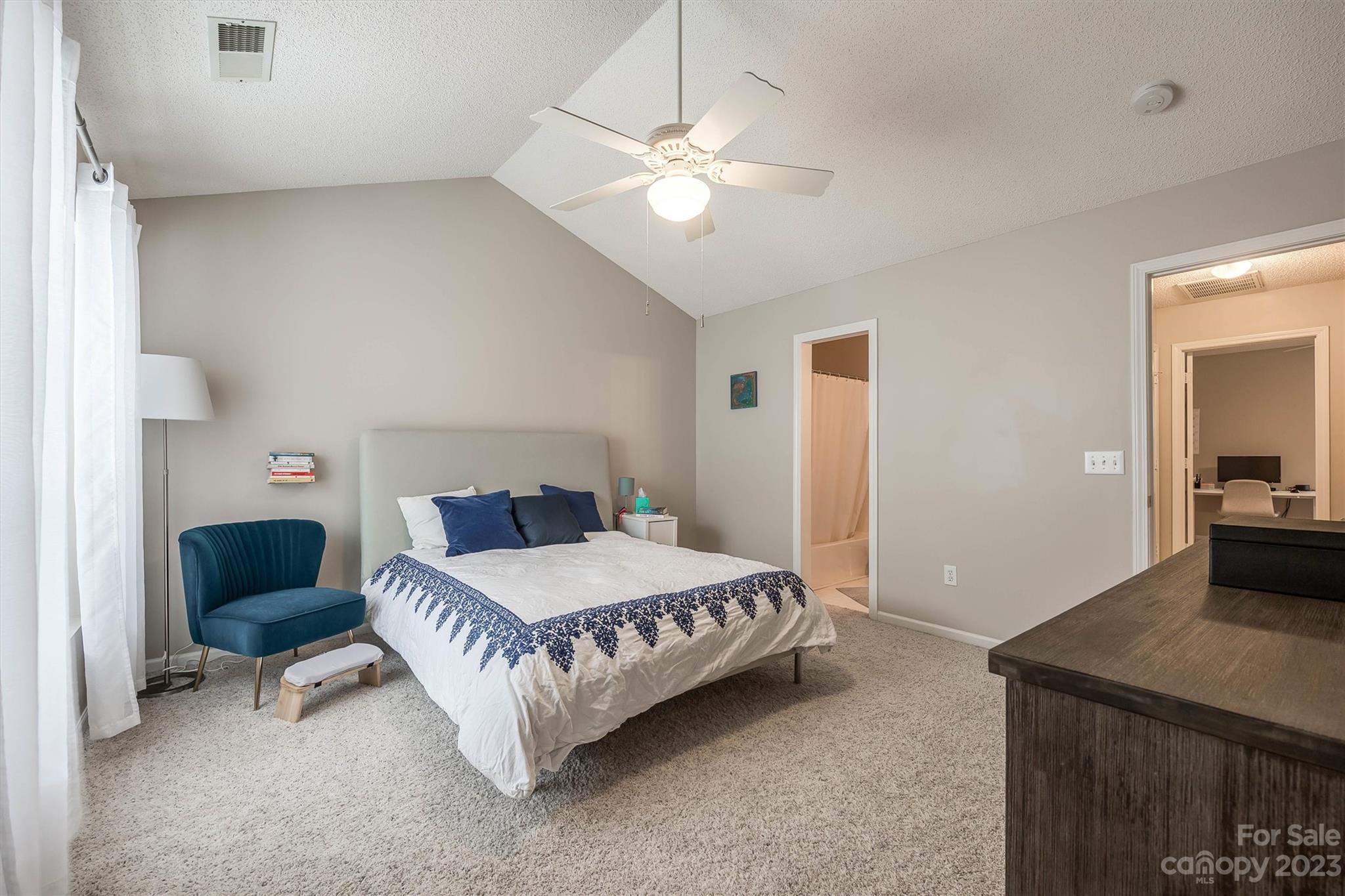 9725 Mattforest Circle Charlotte, NC 28277 - Photo 19 of 29 a bedroom with a bed and a chandelier