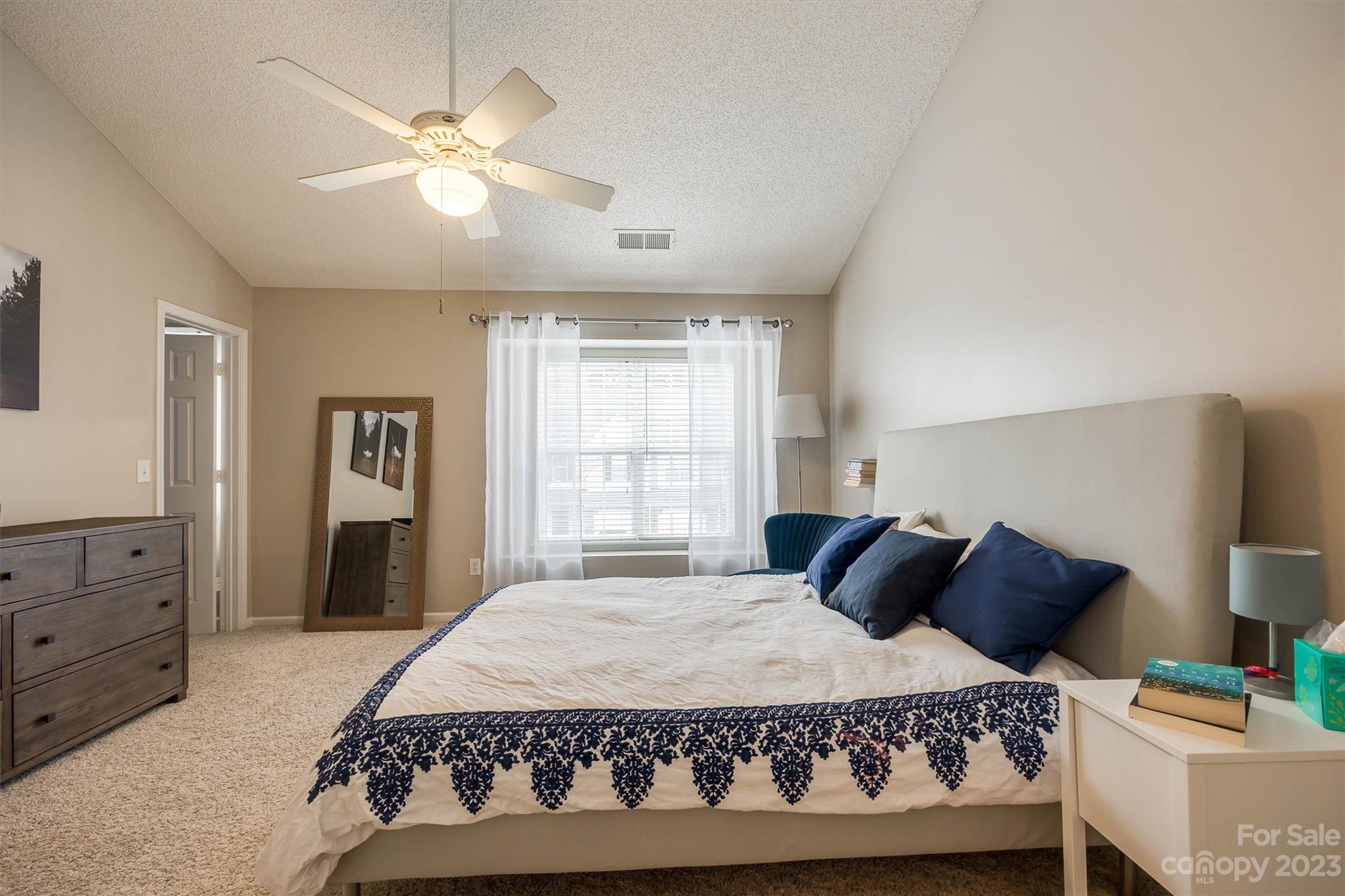 9725 Mattforest Circle Charlotte, NC 28277 - Photo 20 of 29 a large bedroom with a bed and window