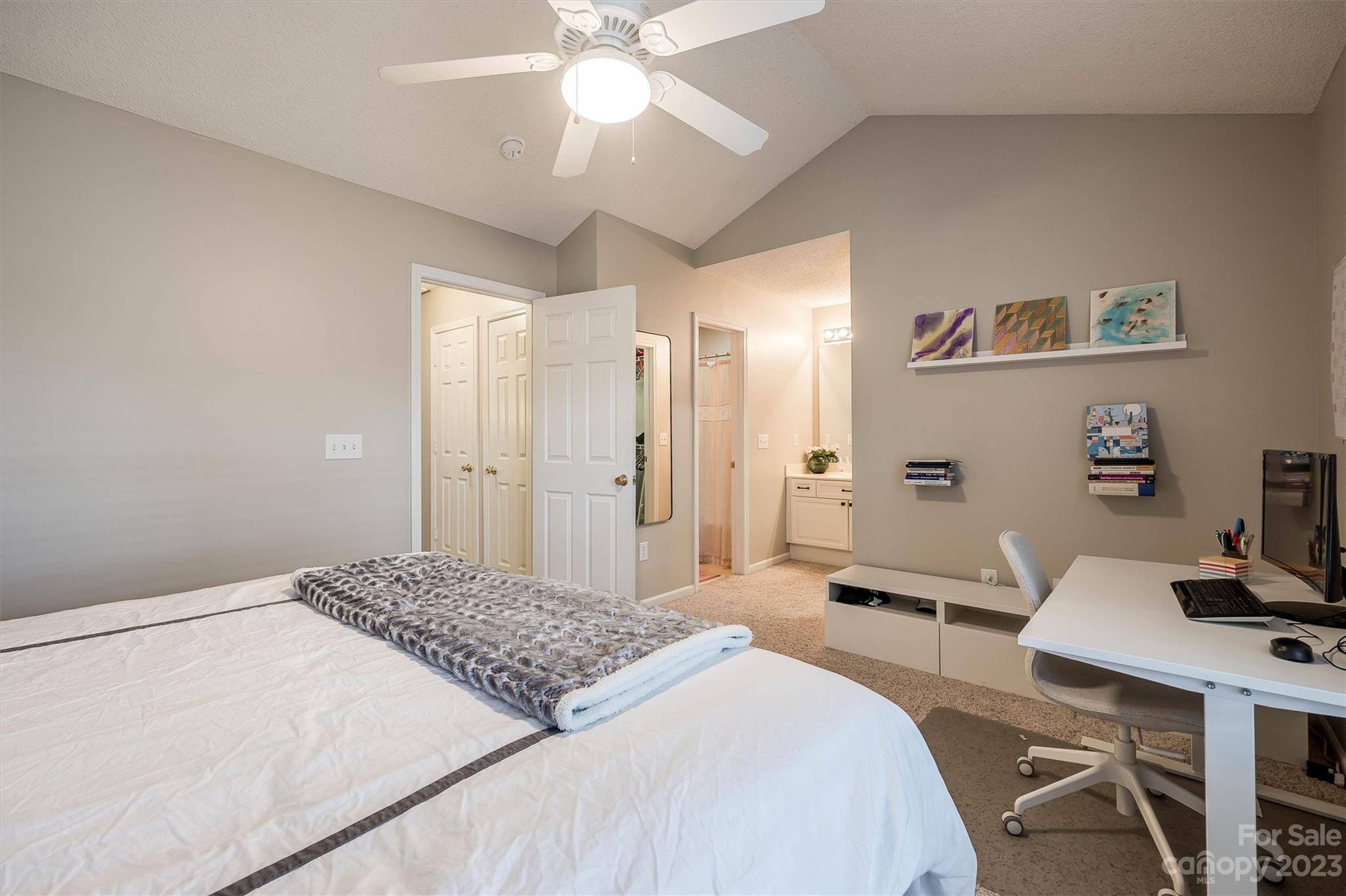 9725 Mattforest Circle Charlotte, NC 28277 - Photo 23 of 29 a bedroom with a bed and a chandelier