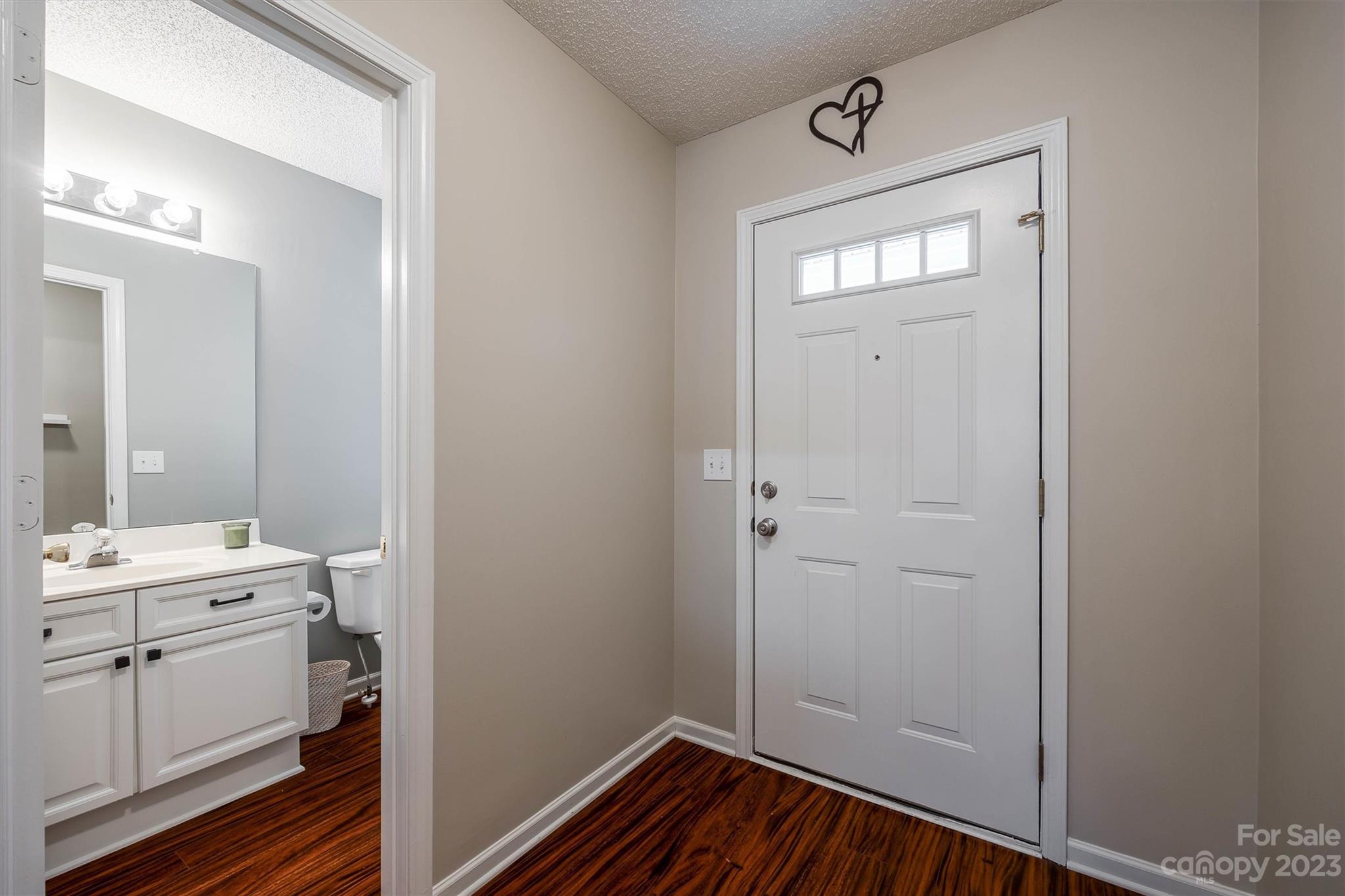 9725 Mattforest Circle Charlotte, NC 28277 - Photo 3 of 29 a view of a bathroom with sink mirror and window
