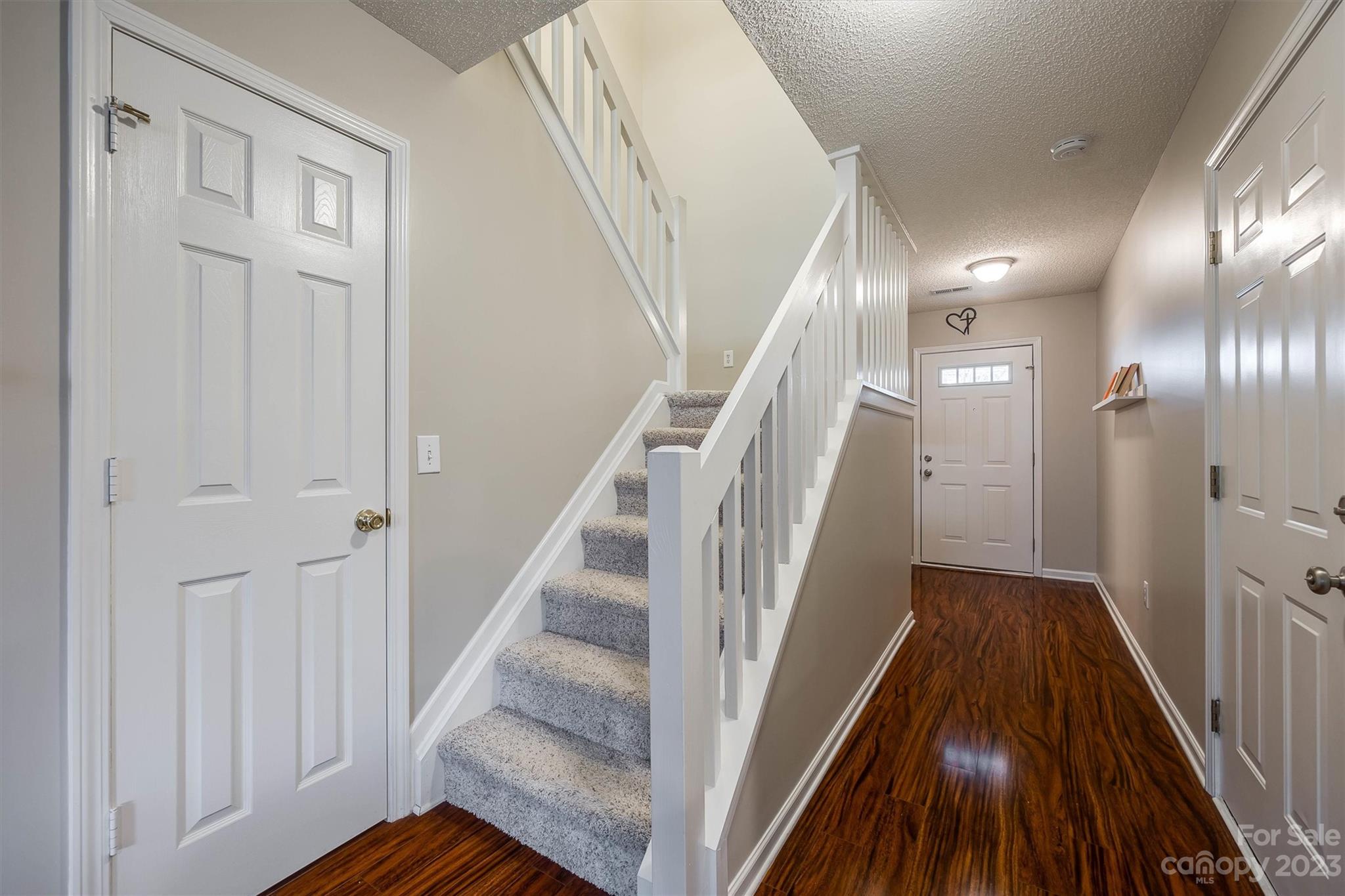 9725 Mattforest Circle Charlotte, NC 28277 - Photo 6 of 29 a view of a hallway with wooden floor and entryway