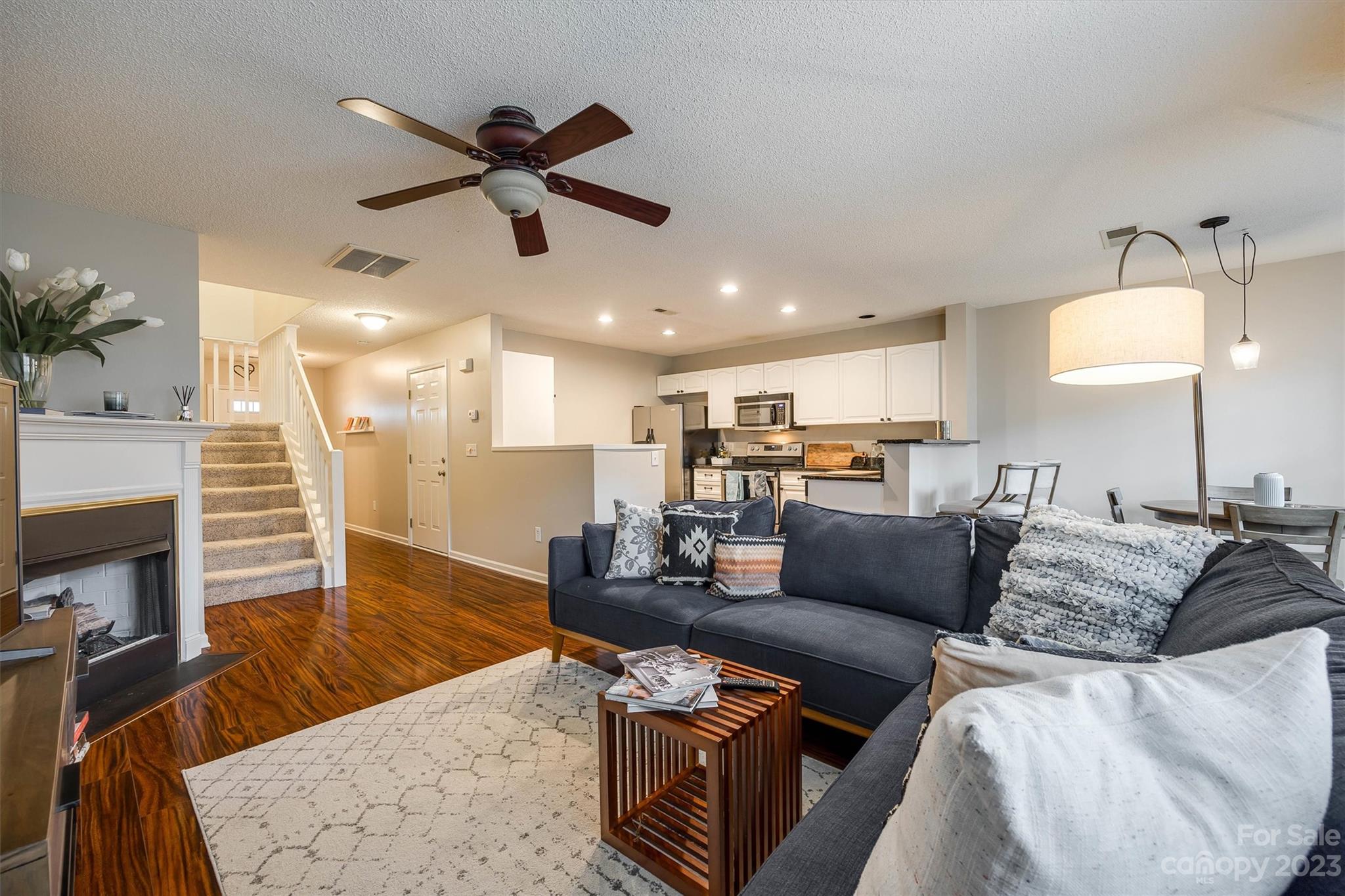 9725 Mattforest Circle Charlotte, NC 28277 - Photo 9 of 29 a living room with furniture and a wooden floor
