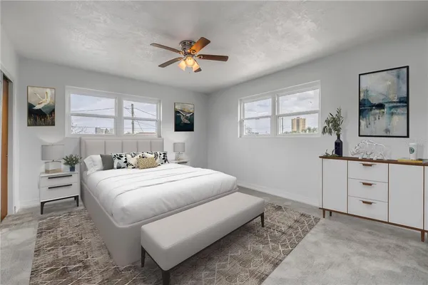 a bedroom with a bed and a window