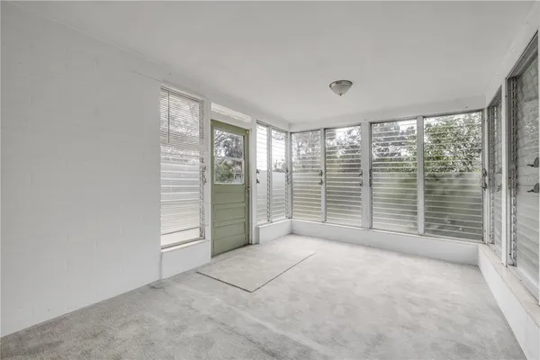 a view of a room with large windows