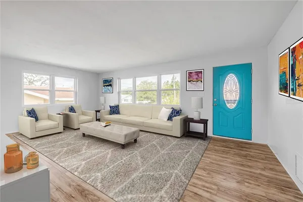 a living room with furniture and a window