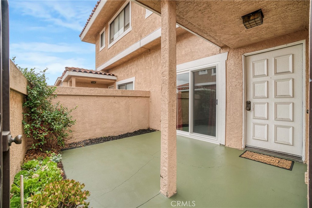 21602 South Figueroa Street, Unit 10 Carson, CA 90745 - Photo 19 of 25 a front view of a house with garden