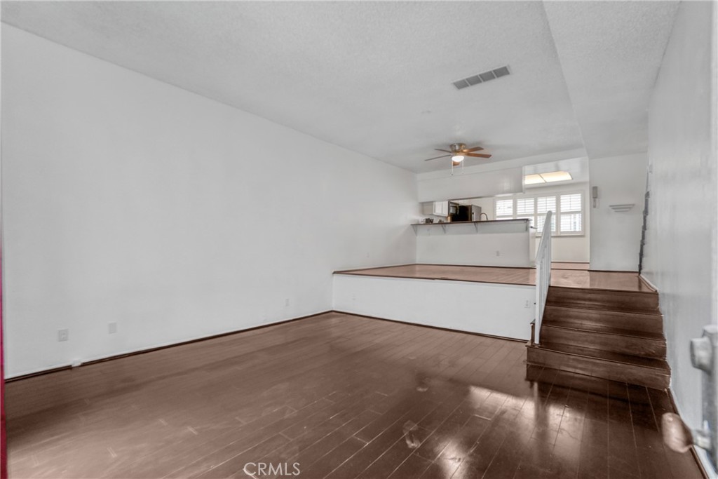 21602 South Figueroa Street, Unit 10 Carson, CA 90745 - Photo 2 of 25 a view of entryway and hall with wooden floor