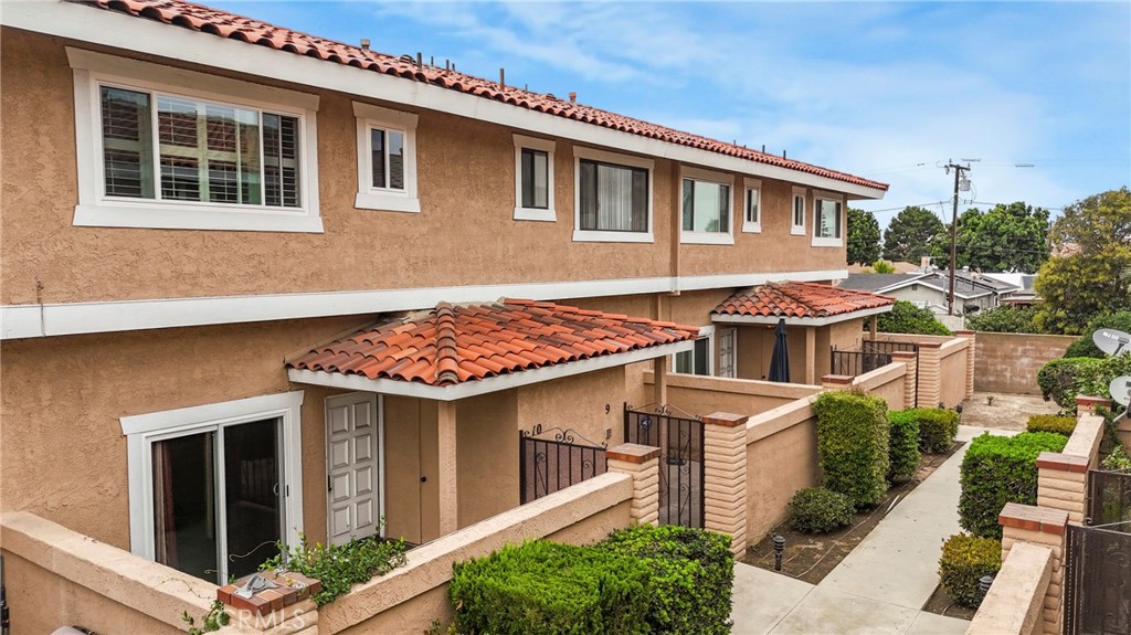 21602 South Figueroa Street, Unit 10 Carson, CA 90745 - Photo 22 of 25 a front view of a house with a yard