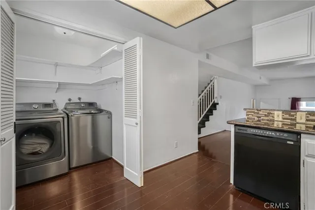 a kitchen with a stove and a refrigerator