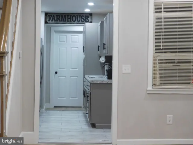 a kitchen with granite countertop cabinets and steel stainless steel appliances