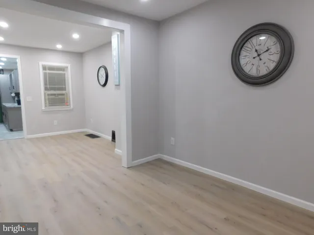 a kitchen with a refrigerator and a sink