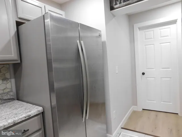 a white toilet sitting next to a window