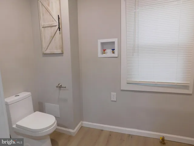 a bathroom with a shower and a bath tub
