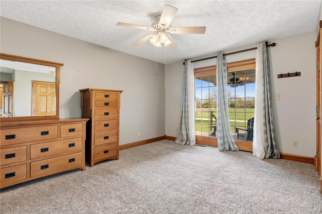 4971 Lackey Road Cedarville, OH 45314 - Photo 60 of 79 This spacious bedroom offers comfortable carpeting and direct access to the outdoors.