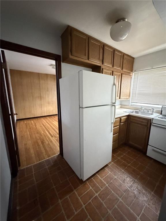 5839 Darlington Road, Unit 1 Pittsburgh, PA 15217 - Photo 14 of 18 a white refrigerator freezer and a dishwasher in a kitchen