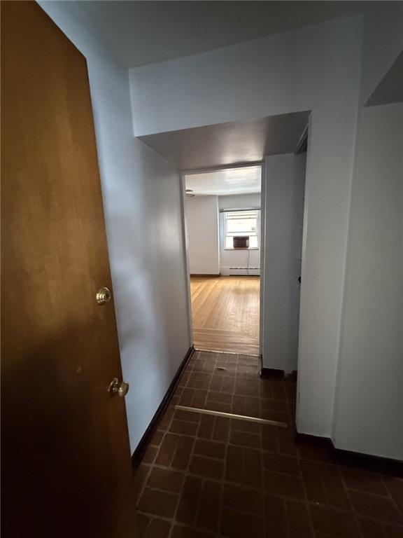 5839 Darlington Road, Unit 1 Pittsburgh, PA 15217 - Photo 4 of 18 an empty room with wooden floor and door