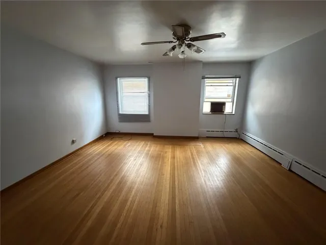 a view of room window and wooden floor
