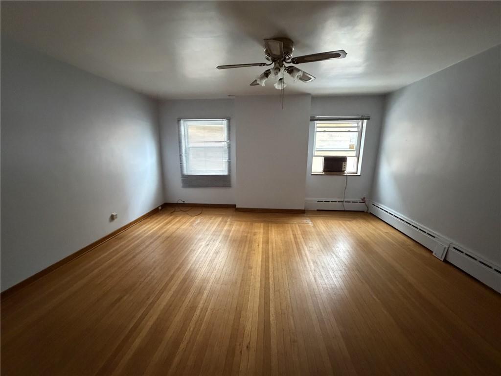 5839 Darlington Road, Unit 1 Pittsburgh, PA 15217 - Photo 6 of 18 a view of room window and wooden floor