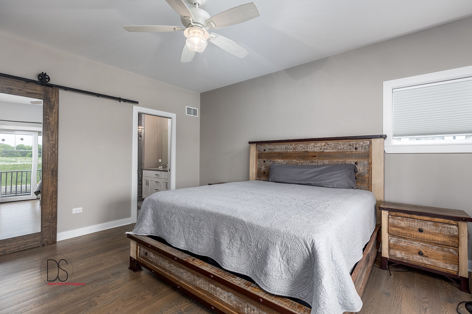 14 Waterside Way Ottawa, IL 61350 - Photo 26 of 36 a bedroom with a bed and a chandelier