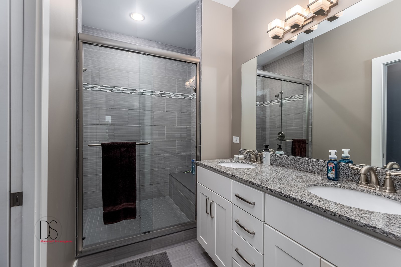 14 Waterside Way Ottawa, IL 61350 - Photo 27 of 36 a bathroom with a granite countertop sink a mirror and shower
