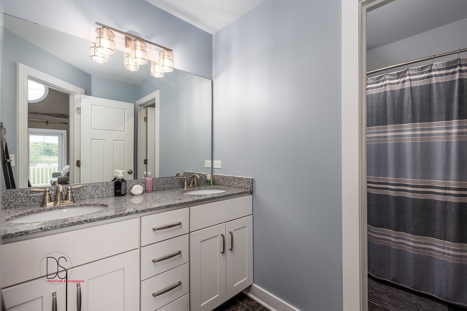14 Waterside Way Ottawa, IL 61350 - Photo 30 of 36 a bathroom with a double vanity sink and a mirror