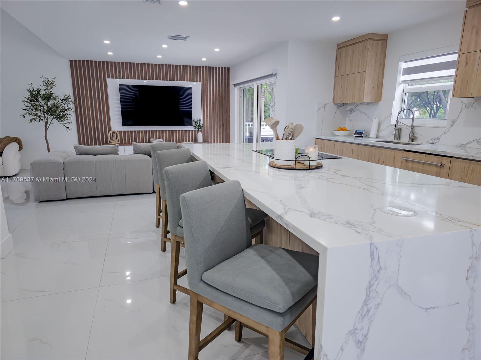 18199 Southwest 3rd Street Pembroke Pines, FL 33029 - Photo 12 of 31 a living room with furniture and a flat screen tv
