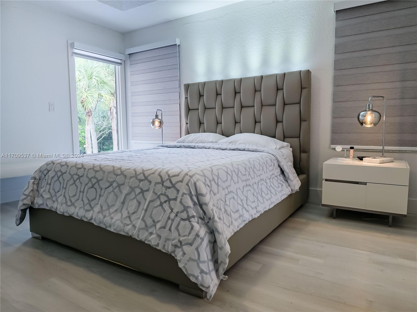 18199 Southwest 3rd Street Pembroke Pines, FL 33029 - Photo 14 of 31 a bedroom with a bed and window