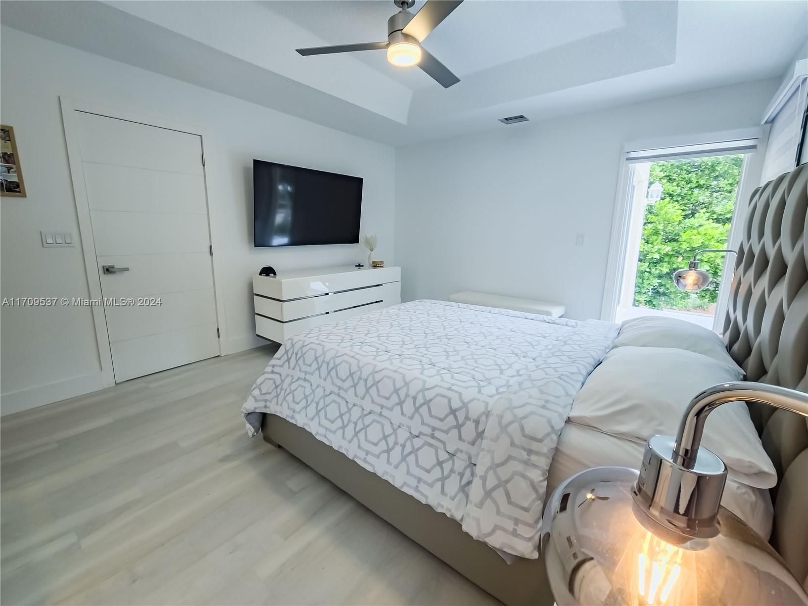 18199 Southwest 3rd Street Pembroke Pines, FL 33029 - Photo 20 of 31 a living room with furniture and a flat screen tv