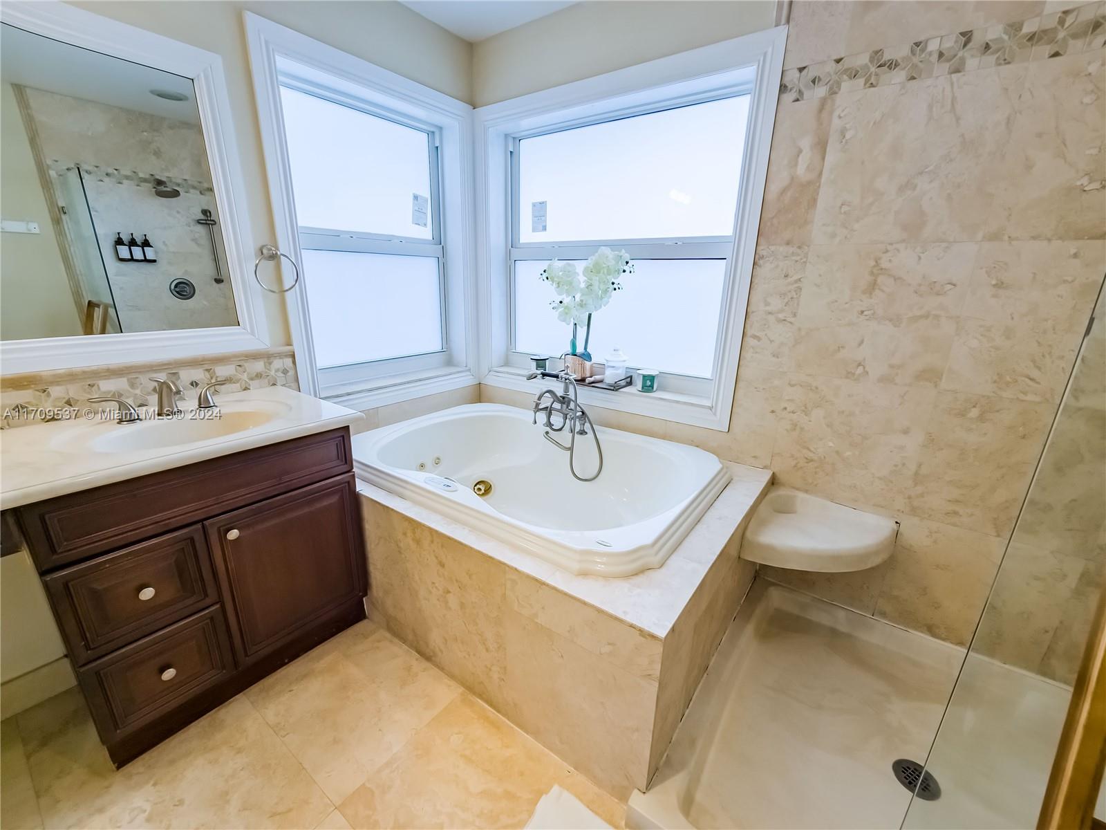 18199 Southwest 3rd Street Pembroke Pines, FL 33029 - Photo 22 of 31 a bathroom with a sink and a mirror