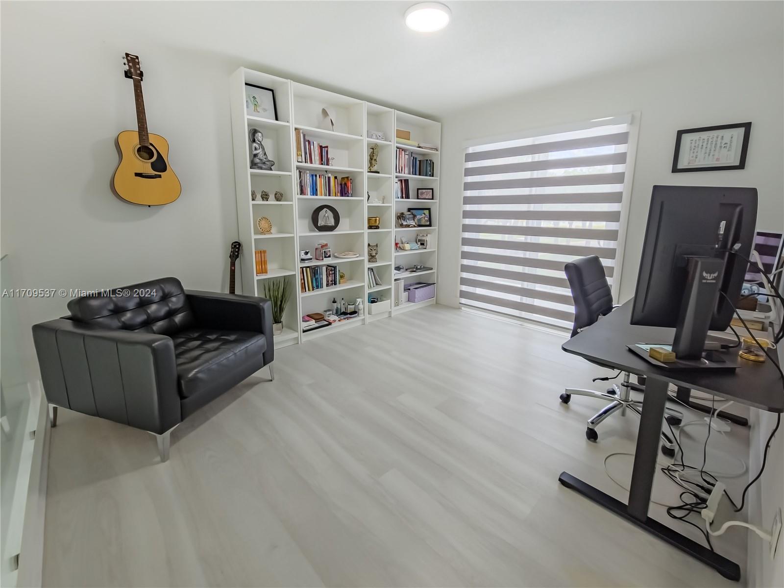 18199 Southwest 3rd Street Pembroke Pines, FL 33029 - Photo 25 of 31 a living room with furniture and a window