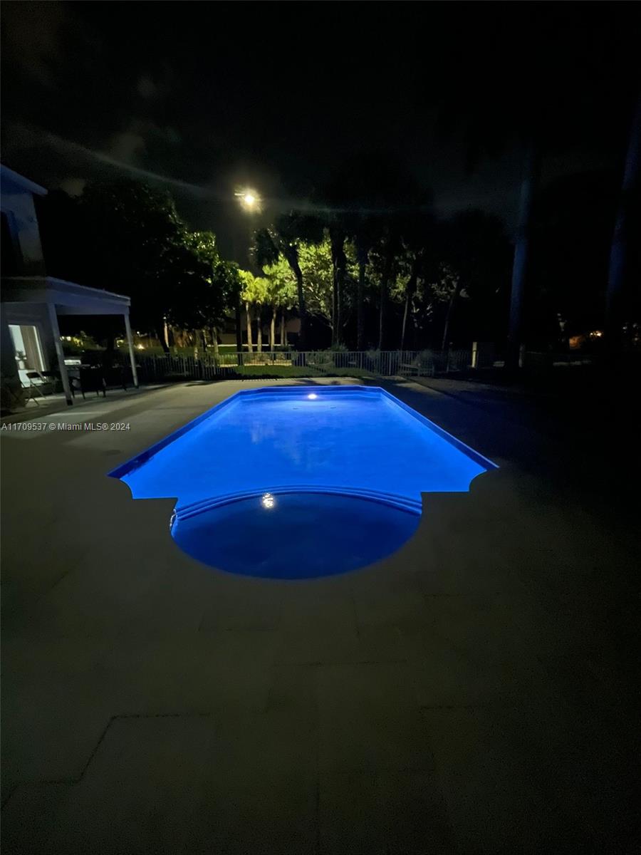 18199 Southwest 3rd Street Pembroke Pines, FL 33029 - Photo 30 of 31 a view of a swimming pool with seating space